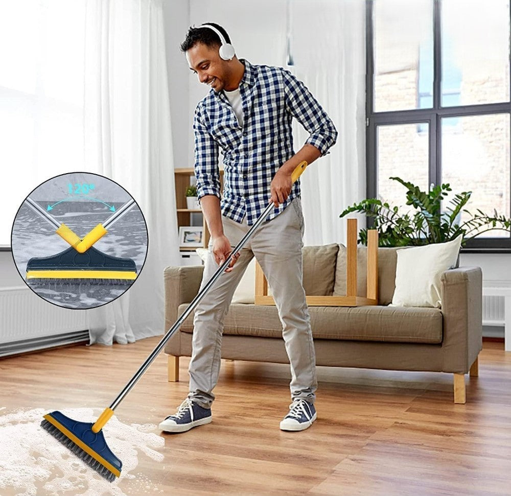 Scrubbing the living room floor with the long-handle brush