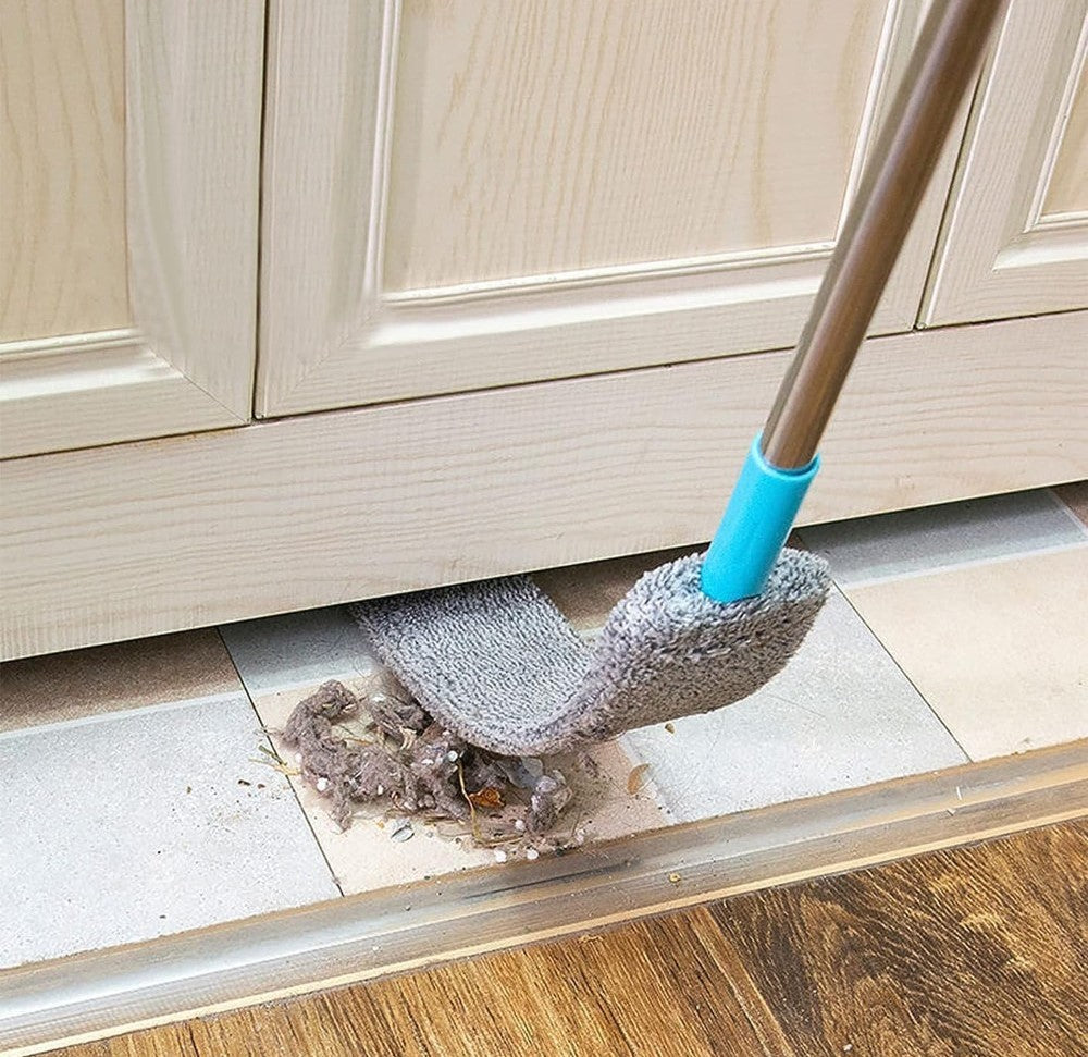 Gap duster pulling dust from under a door