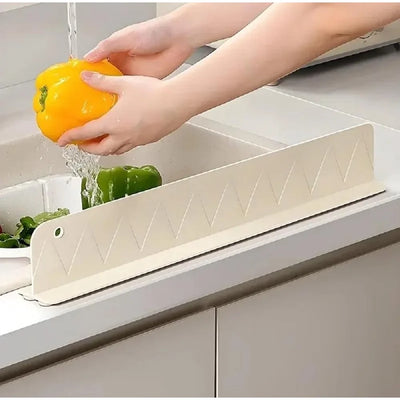 Silicone splash guard keeping a kitchen counter dry