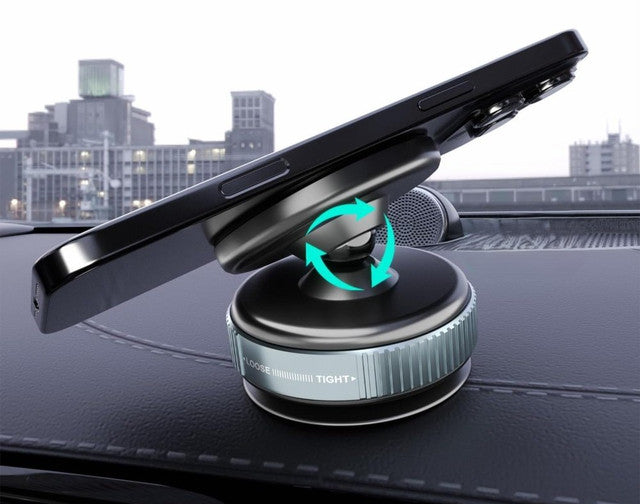 Phone held by the magnetic mount on a car dashboard